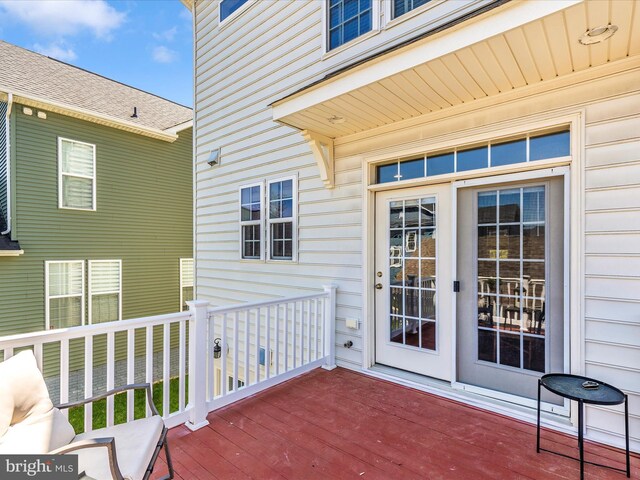 entrance to property featuring a wooden deck
