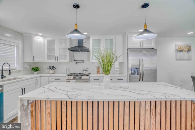 2832 Edgemont St, Philadelphia, PA 19134 - kitchen with glass insert cabinets, wall chimney range hood, appliances with stainless steel finishes, and a sink