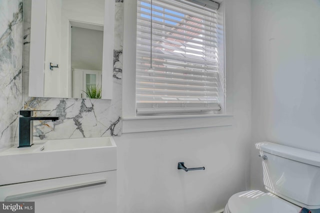 2832 Edgemont St, Philadelphia, PA 19134 - half bath with toilet, vanity, and decorative backsplash
