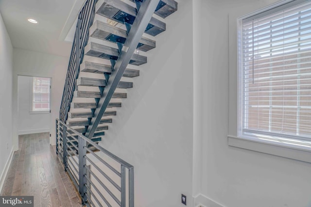 2832 Edgemont St, Philadelphia, PA 19134 - staircase featuring wood-type flooring, a healthy amount of sunlight, baseboards, and recessed lighting