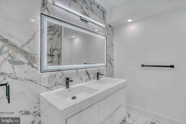 2832 Edgemont St, Philadelphia, PA 19134 - bathroom featuring marble finish floor, baseboards, a sink, and double vanity