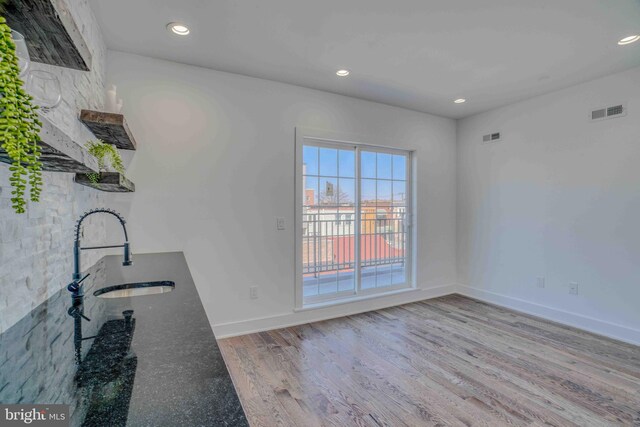 2832 Edgemont St, Philadelphia, PA 19134 - interior space featuring baseboards, wood finished floors, a sink, and recessed lighting