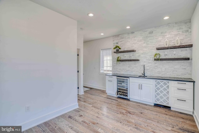 2832 Edgemont St, Philadelphia, PA 19134 - bar with a sink, baseboards, backsplash, wet bar, and wine cooler