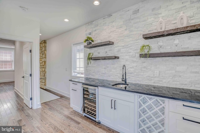 2832 Edgemont St, Philadelphia, PA 19134 - bar with wine cooler, a sink, baseboards, light wood-style floors, and indoor wet bar