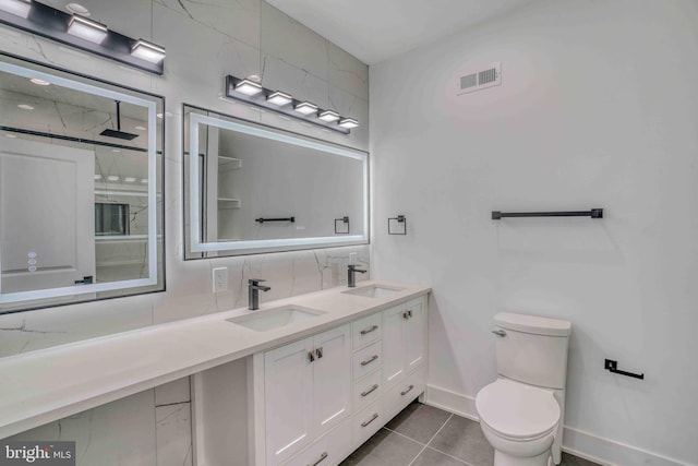 2832 Edgemont St, Philadelphia, PA 19134 - full bathroom featuring tile patterned floors, toilet, baseboards, and a sink