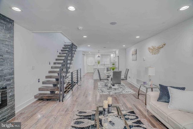 2832 Edgemont St, Philadelphia, PA 19134 - living room with light wood-type flooring, baseboards, recessed lighting, and stairs