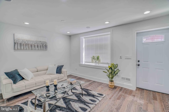 2832 Edgemont St, Philadelphia, PA 19134 - living area with baseboards, wood finished floors, visible vents, and a healthy amount of sunlight