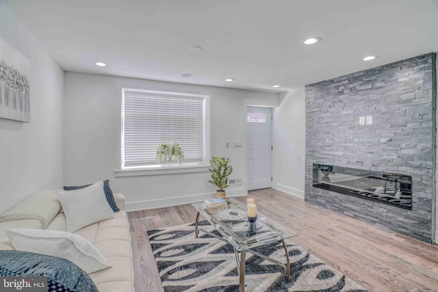 2832 Edgemont St, Philadelphia, PA 19134 - living area with baseboards, recessed lighting, wood finished floors, and a fireplace