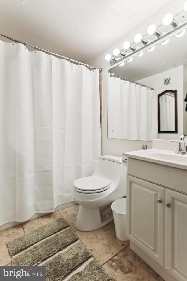 2141 P St NW Unit 1010, Washington, DC 20037 - bathroom with vanity, toilet, and visible vents