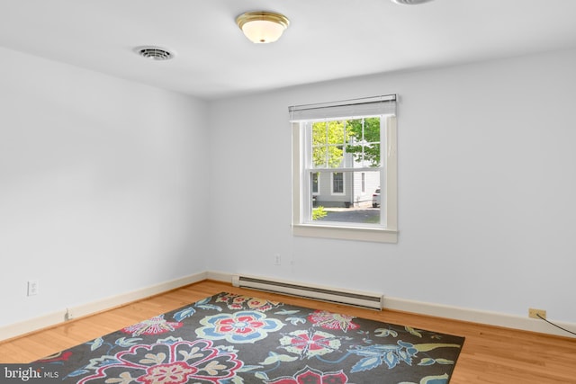 103 W Marengo, Saint Michaels, MD 21663 - unfurnished room featuring baseboards, baseboard heating, visible vents, and wood finished floors
