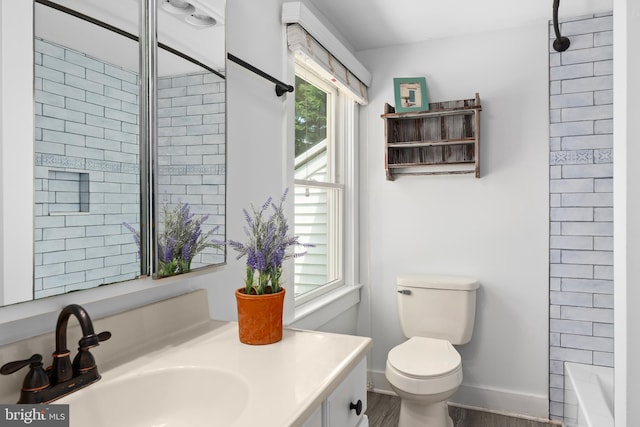 103 W Marengo, Saint Michaels, MD 21663 - full bathroom featuring toilet, wood finished floors, a shower, baseboards, and vanity