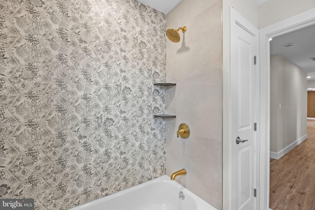 full bath featuring tub / shower combination and wood finished floors