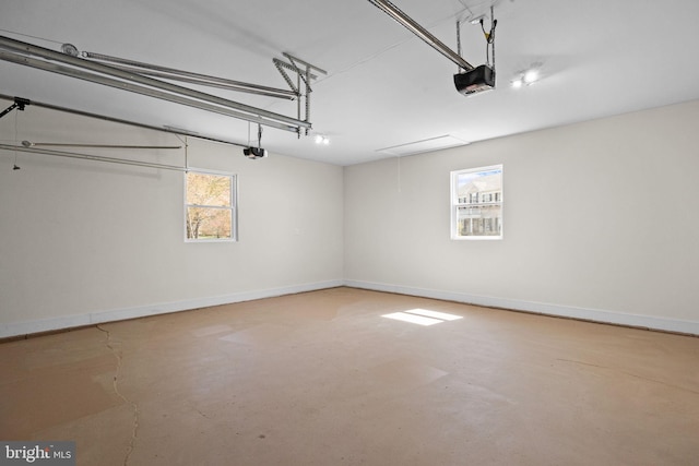 garage featuring baseboards and a garage door opener