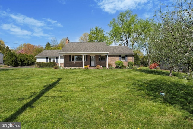 ranch-style home with brick siding, a front lawn, covered porch, and a chimney