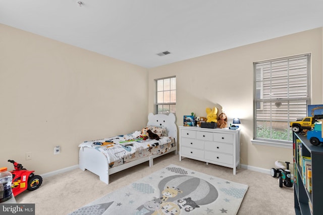 bedroom featuring carpet floors, baseboards, and visible vents