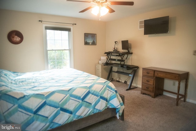 bedroom featuring baseboards, a ceiling fan, and carpet flooring