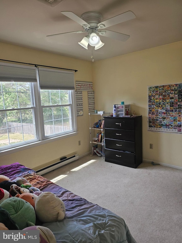 bedroom with carpet floors, baseboards, a baseboard heating unit, and ceiling fan