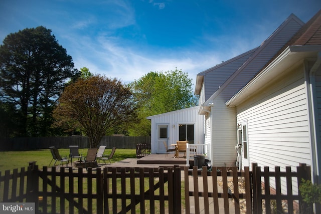 exterior space with a fenced backyard and a yard