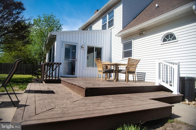 wooden deck with fence and outdoor dining area