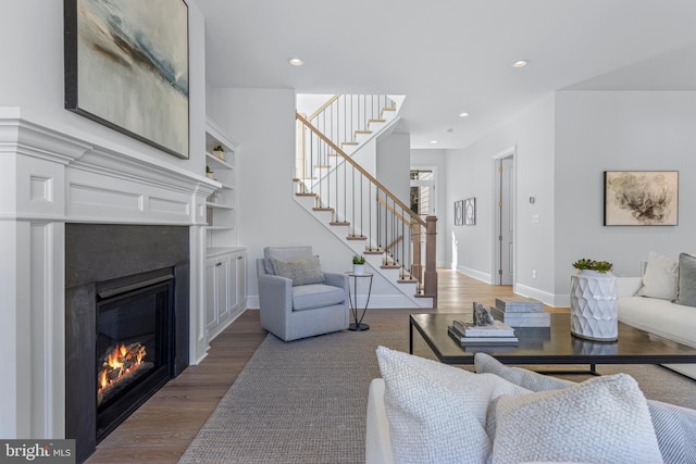 238 N Aberdeen Ave Lot 2, Wayne, PA 19087 - living area featuring wood finished floors, a glass covered fireplace, stairs, and recessed lighting