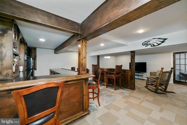 bar with beamed ceiling, recessed lighting, and a bar