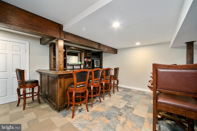 bar with recessed lighting, baseboards, and a dry bar
