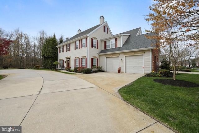 view of side of property featuring concrete driveway, a chimney, a lawn, a garage, and roof with shingles