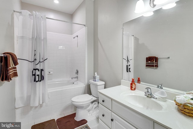 full bath featuring tiled shower / bath combo, toilet, tile patterned flooring, and vanity