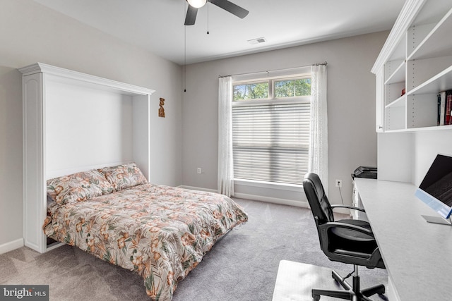 bedroom with carpet floors, baseboards, a ceiling fan, and visible vents