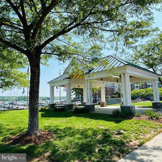view of property's community featuring a lawn and a gazebo