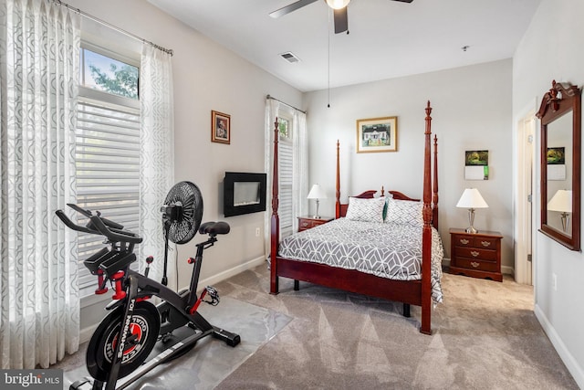bedroom with baseboards, ceiling fan, carpet, and visible vents