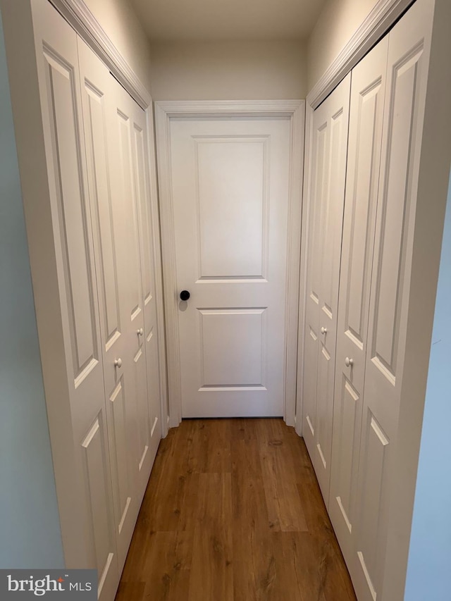 doorway to outside with dark wood-style flooring