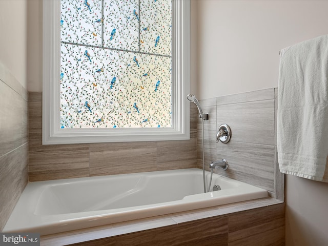 full bath with walk in shower and a relaxing tiled tub