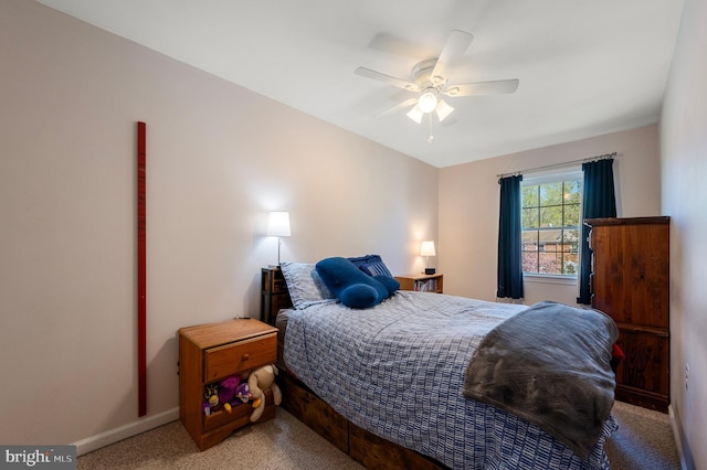 bedroom featuring baseboards, a ceiling fan, and carpet flooring