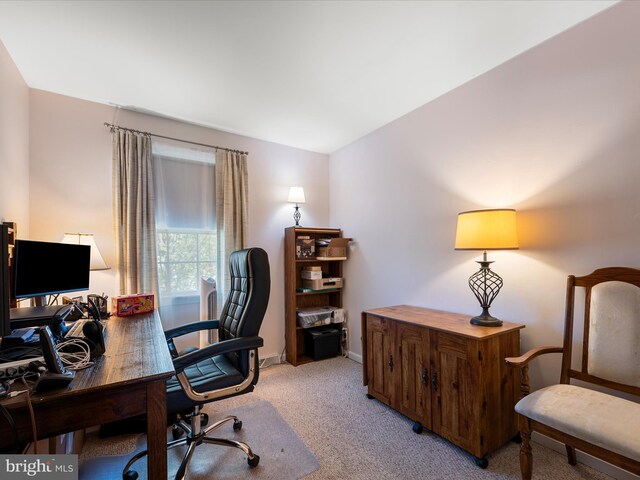 office with light carpet and baseboards