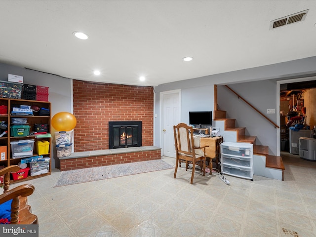 office area with recessed lighting, a brick fireplace, visible vents, and tile patterned floors