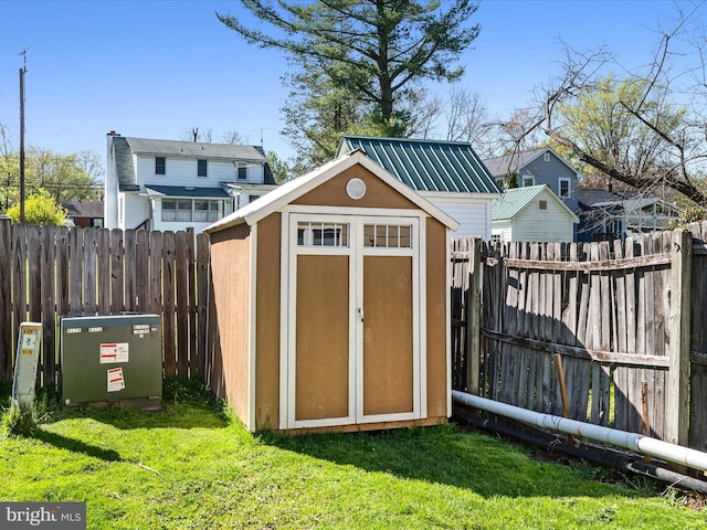 view of shed with a fenced backyard