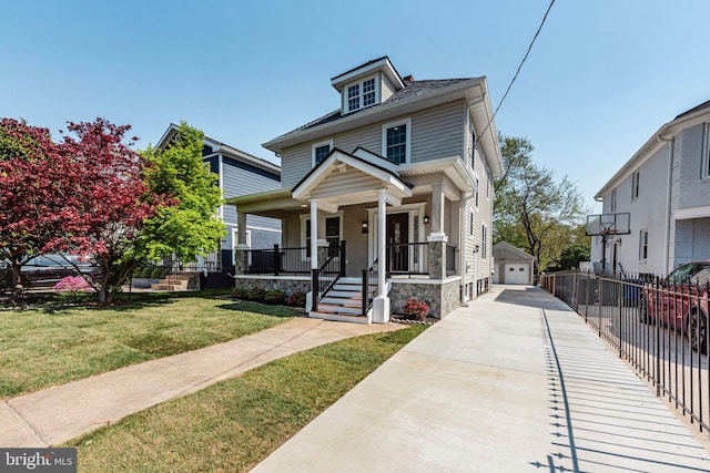 5634 6th St N, Arlington, VA 22205 - american foursquare style home featuring covered porch, an outbuilding, and a detached garage