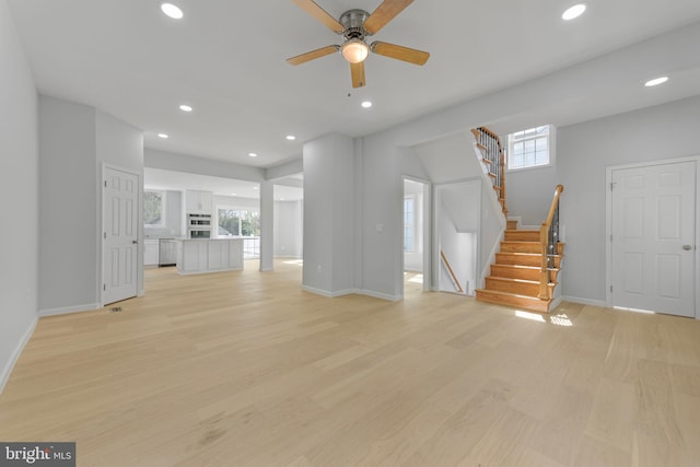 5634 6th St N, Arlington, VA 22205 - unfurnished living room featuring light wood-type flooring, baseboards, ceiling fan, stairs, and recessed lighting