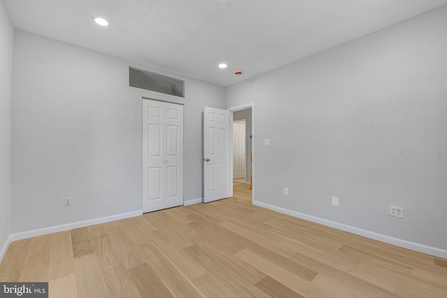 5634 6th St N, Arlington, VA 22205 - unfurnished bedroom featuring light wood-type flooring, baseboards, a closet, and recessed lighting