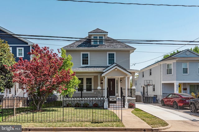 5634 6th St N, Arlington, VA 22205 - american foursquare style home featuring a porch and roof with shingles