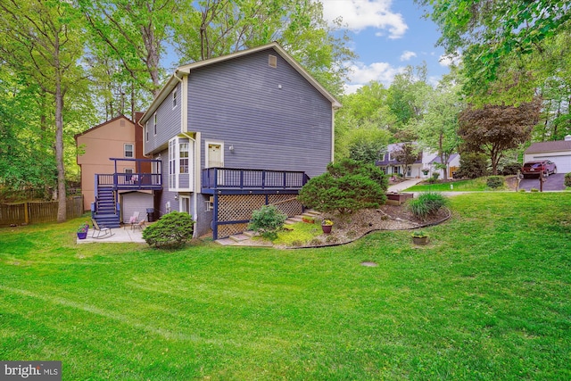 exterior space with a lawn, a wooden deck, stairway, and a patio