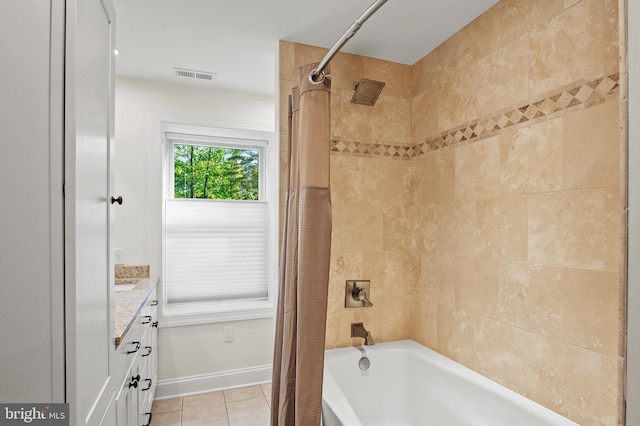 full bath with visible vents, tile patterned flooring, shower / tub combo, baseboards, and vanity