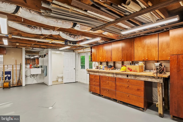 below grade area with a sink
