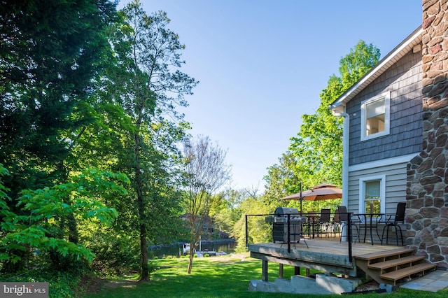 view of yard with a wooden deck