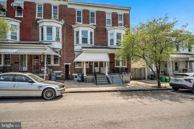 townhome / multi-family property featuring brick siding