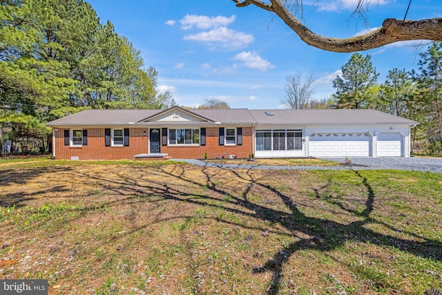 2475 W Denneys Rd, Dover, DE 19904 - ranch-style house with brick siding, an attached garage, a front lawn, and driveway