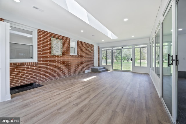 2475 W Denneys Rd, Dover, DE 19904 - unfurnished sunroom featuring visible vents and a skylight