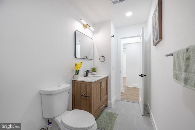 2475 W Denneys Rd, Dover, DE 19904 - bathroom featuring tile patterned floors, visible vents, toilet, vanity, and baseboards