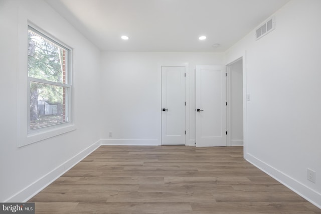 2475 W Denneys Rd, Dover, DE 19904 - unfurnished room with light wood-style flooring, visible vents, and recessed lighting